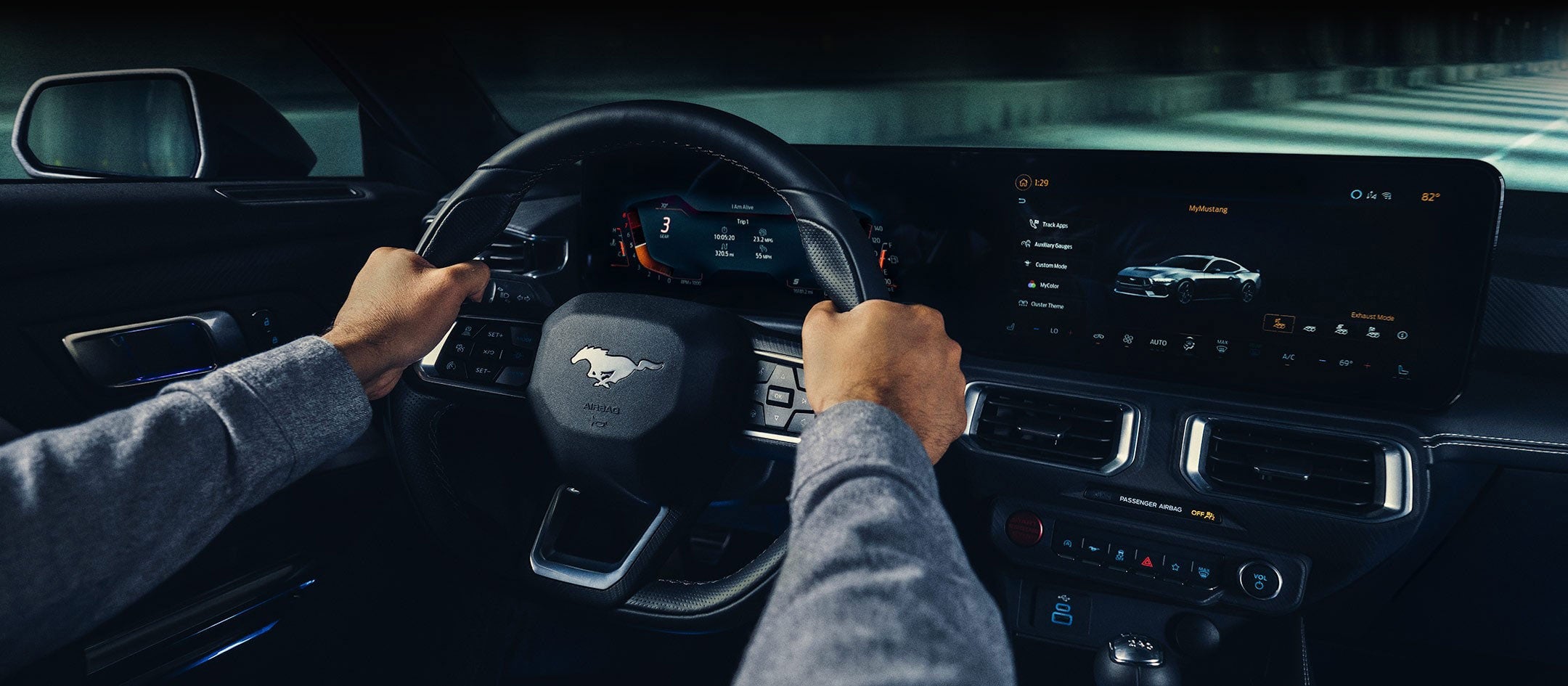 A 2024 Ford Mustang® model interior with a person driving | Donley Ford of Mt. Vernon, Inc in Mount Vernon OH